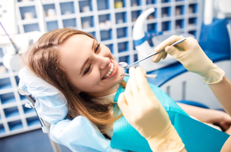 Dental Veneers in Guildford displayed on a model, showcasing a perfect, white smile.