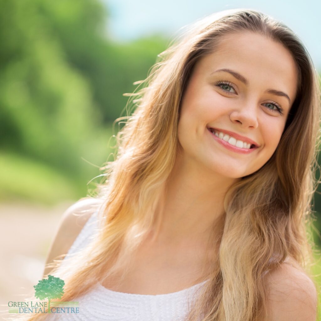 A patient smiling confidently after receiving Dental Implants in Penge.