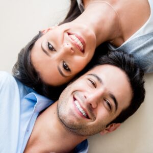 A patient smiling confidently after receiving Dental Implants in Lower Sydenham at Green Lane Dental Centre.