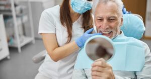 Smiling patient after Full-Jaw Implant in Penge with All-on-6 procedure 